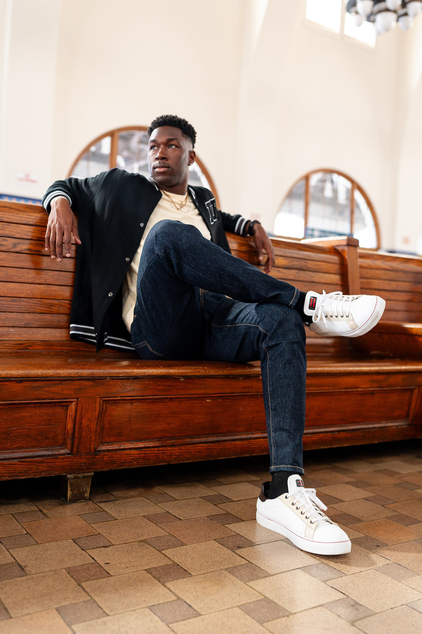 Model wearing the DapperBoi ❤️ S25 Low-Tops, a gender-inclusive sneaker designed for all identities, made with 100% vegan leather and handmade in Italy. (Image courtesy of Shay Studios and DapperBoi).