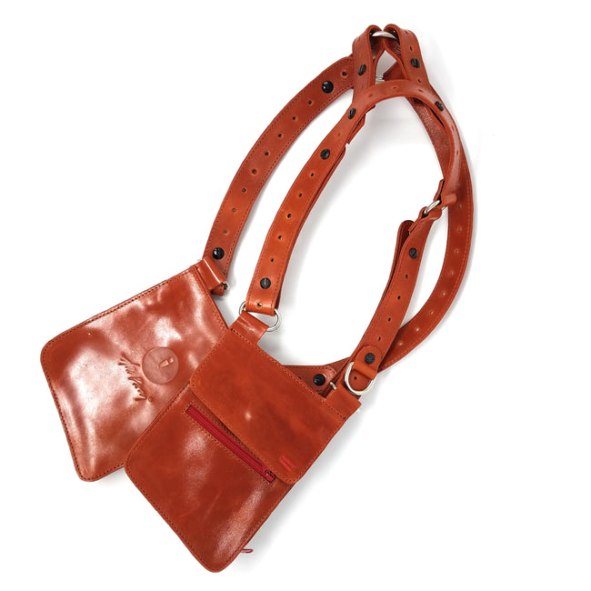 NiK Kacy Modular Utility Holster Harness in Tiger Orange full-grain leather, featuring adjustable straps and a secure wallet compartment.