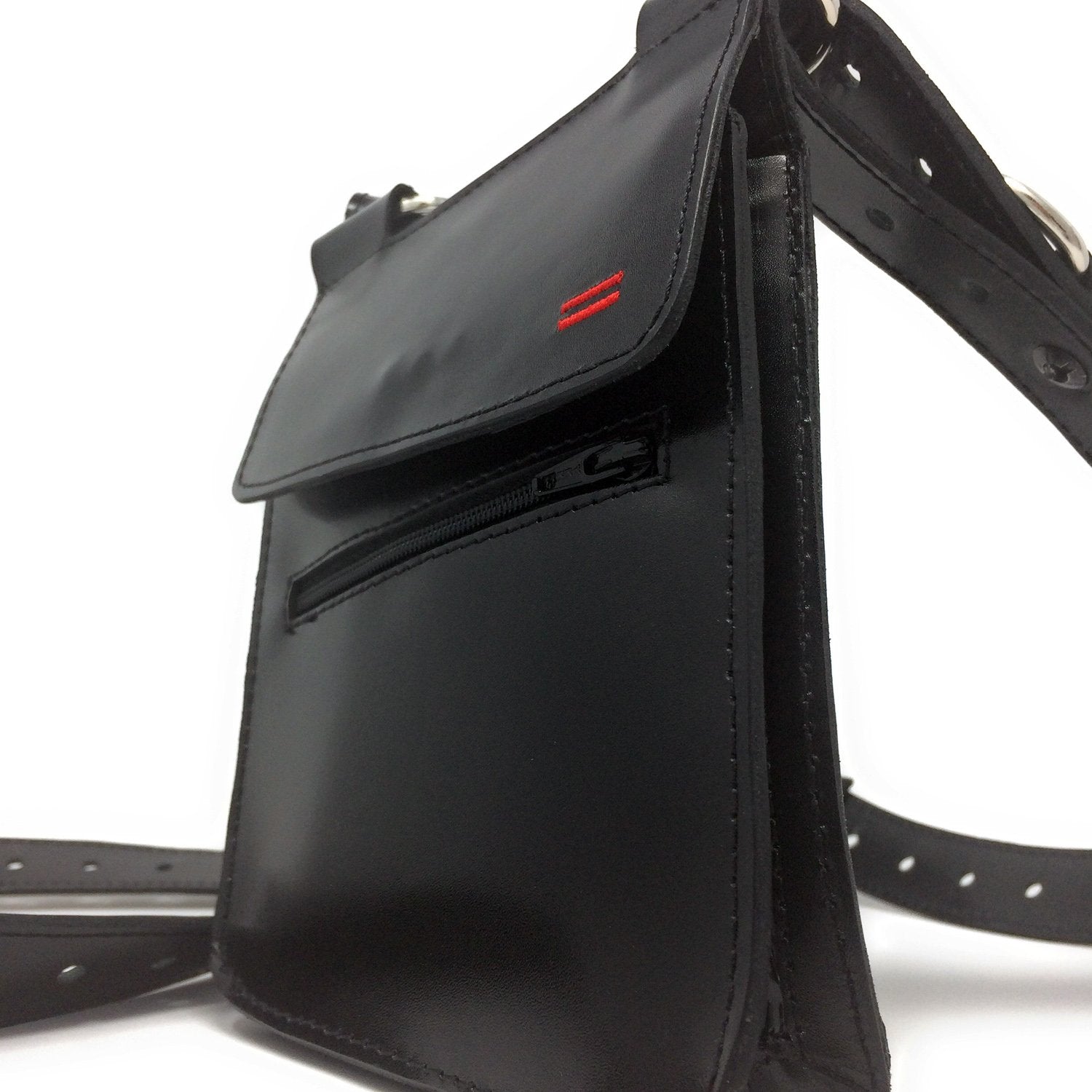 Close-up of the bag compartment on NiK Kacy Holster Harness 2.0, showcasing the secure zipper closures and premium leather craftsmanship.