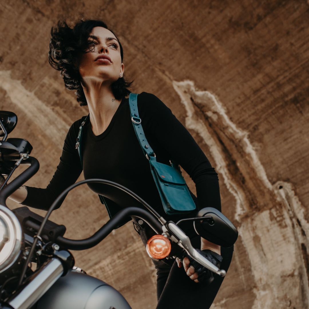 Teela La Roux wearing our NiK Kacy Modular dual holster bags in Teal, staying hands-free and focused on her ride.