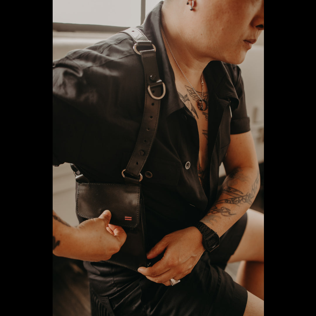 NiK Kacy wearing our original Black 1.0 version modular utility holster bag, showcasing its security and style.